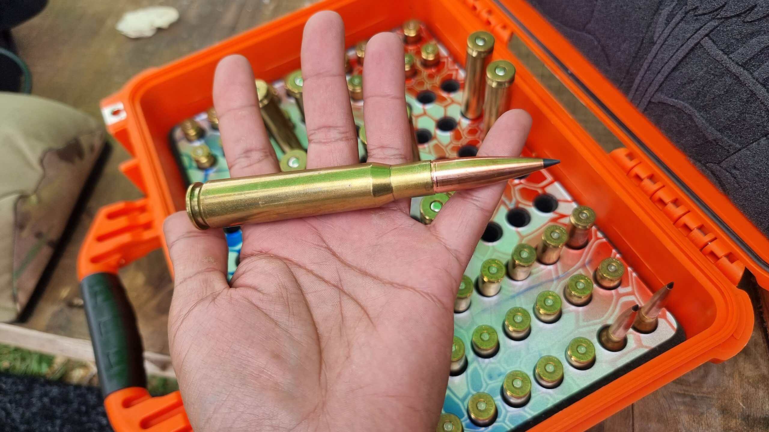50 BMG match cartridge from Jordan Congdon held in a hand